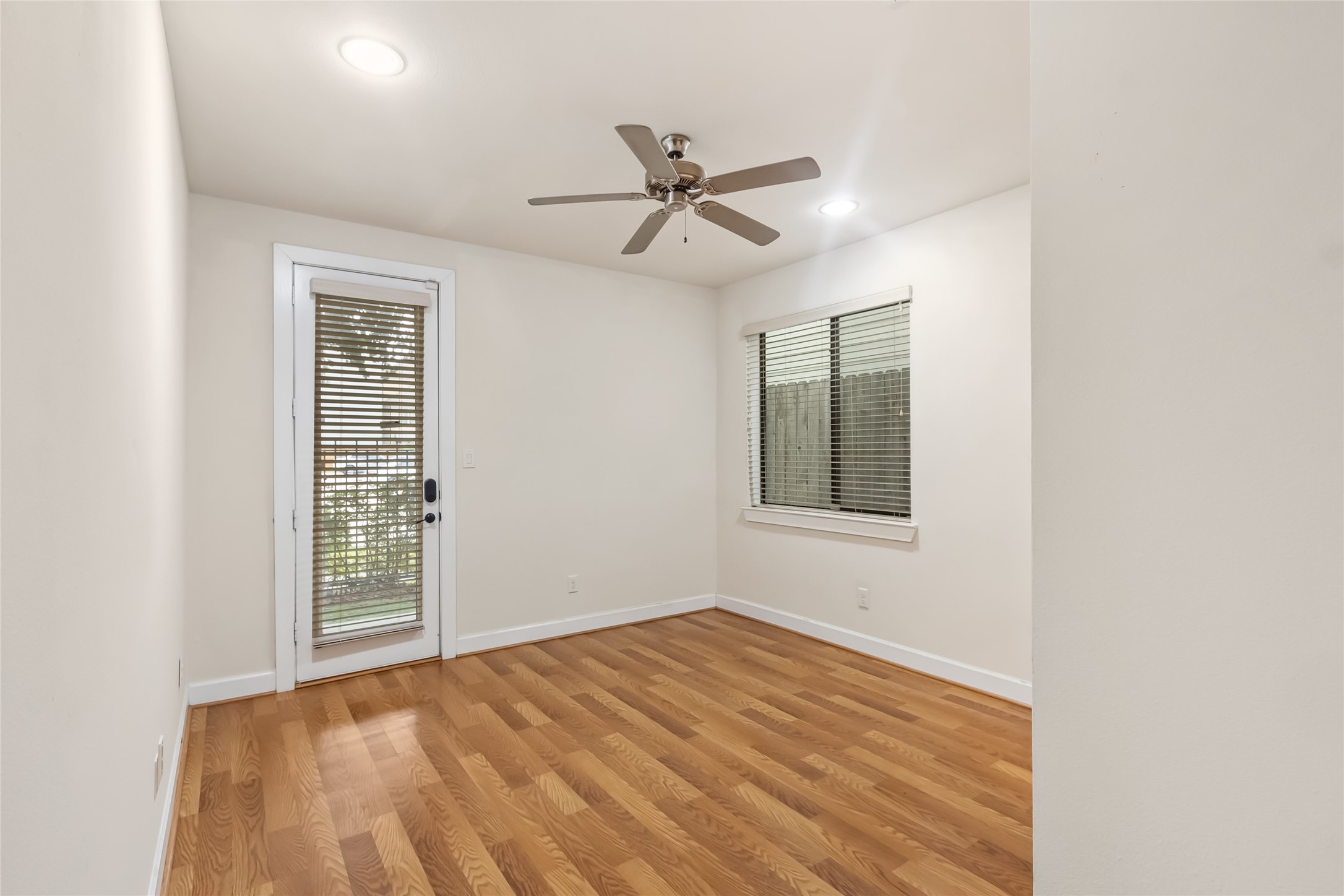 5729 Larkin Street, Unit A Houston, TX 77007 - Photo 16 of 23 a view of empty room with wooden floor and fan