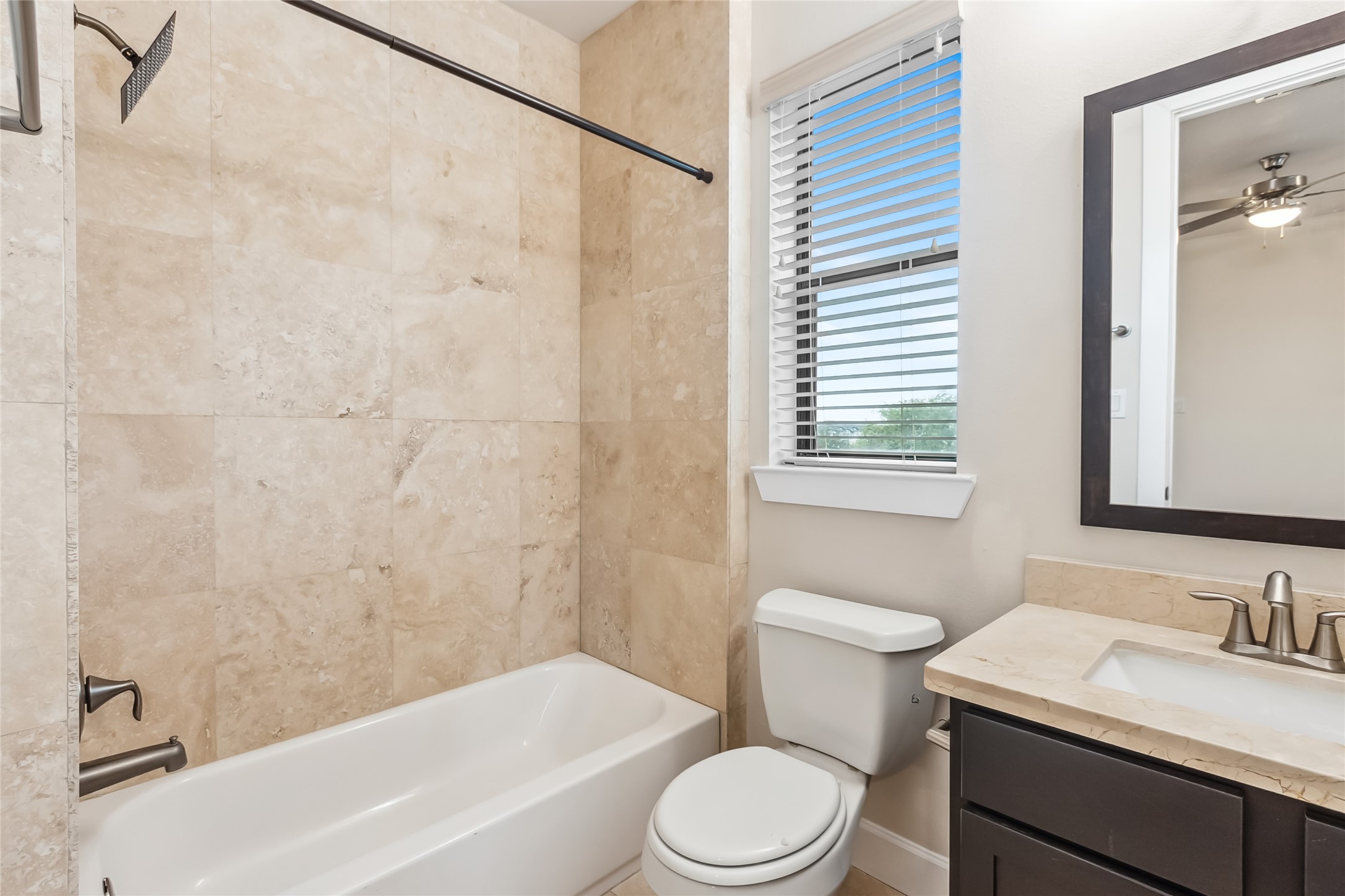 5729 Larkin Street, Unit A Houston, TX 77007 - Photo 17 of 23 a bathroom with a sink a toilet and shower