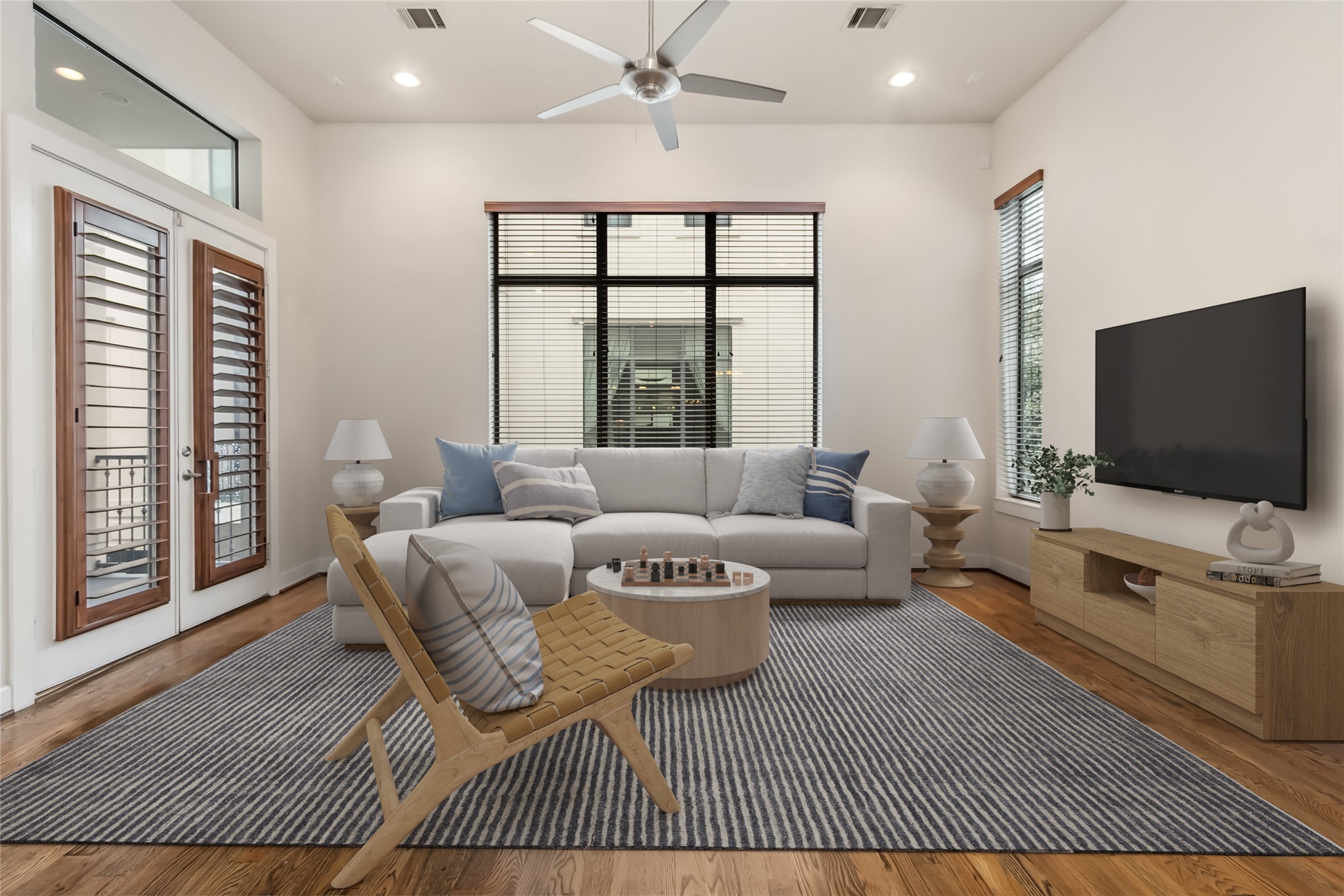 5729 Larkin Street, Unit A Houston, TX 77007 - Photo 2 of 23 a living room with furniture and a flat screen tv