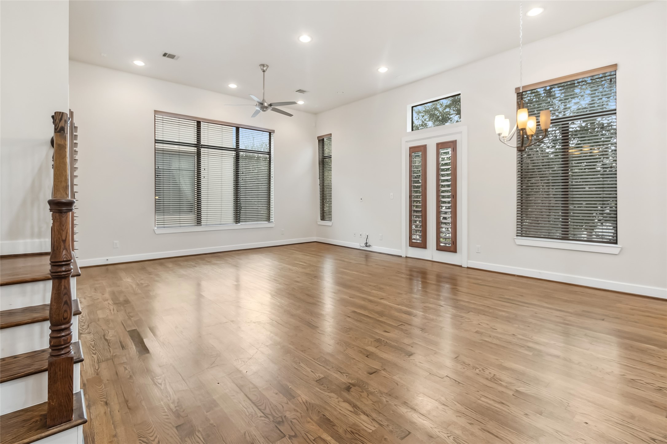 5729 Larkin Street, Unit A Houston, TX 77007 - Photo 7 of 23 a view of an empty room with wooden floor and a window
