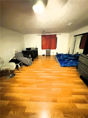 a bed room with a bed and cabinets