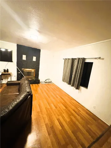 a bedroom with a bed and a night stand