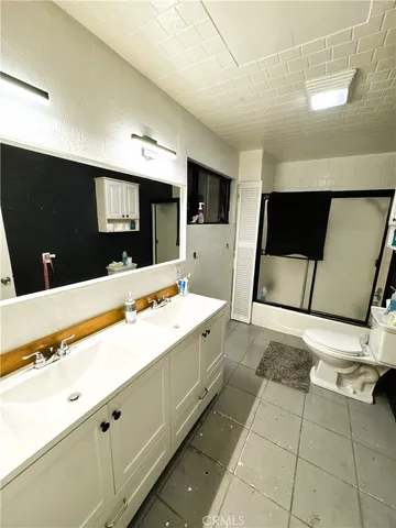 a bathroom with a sink and mirror