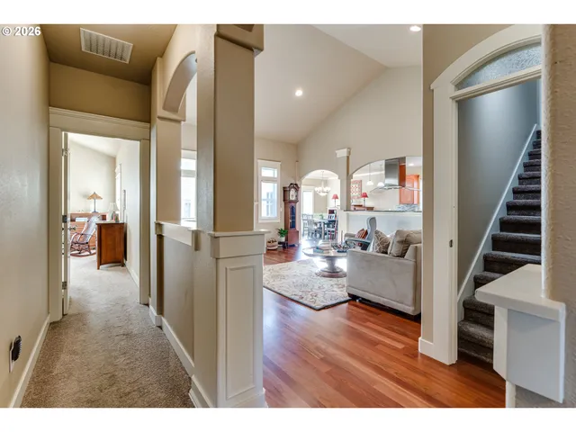 a view of living room and kitchen with furniture and rug