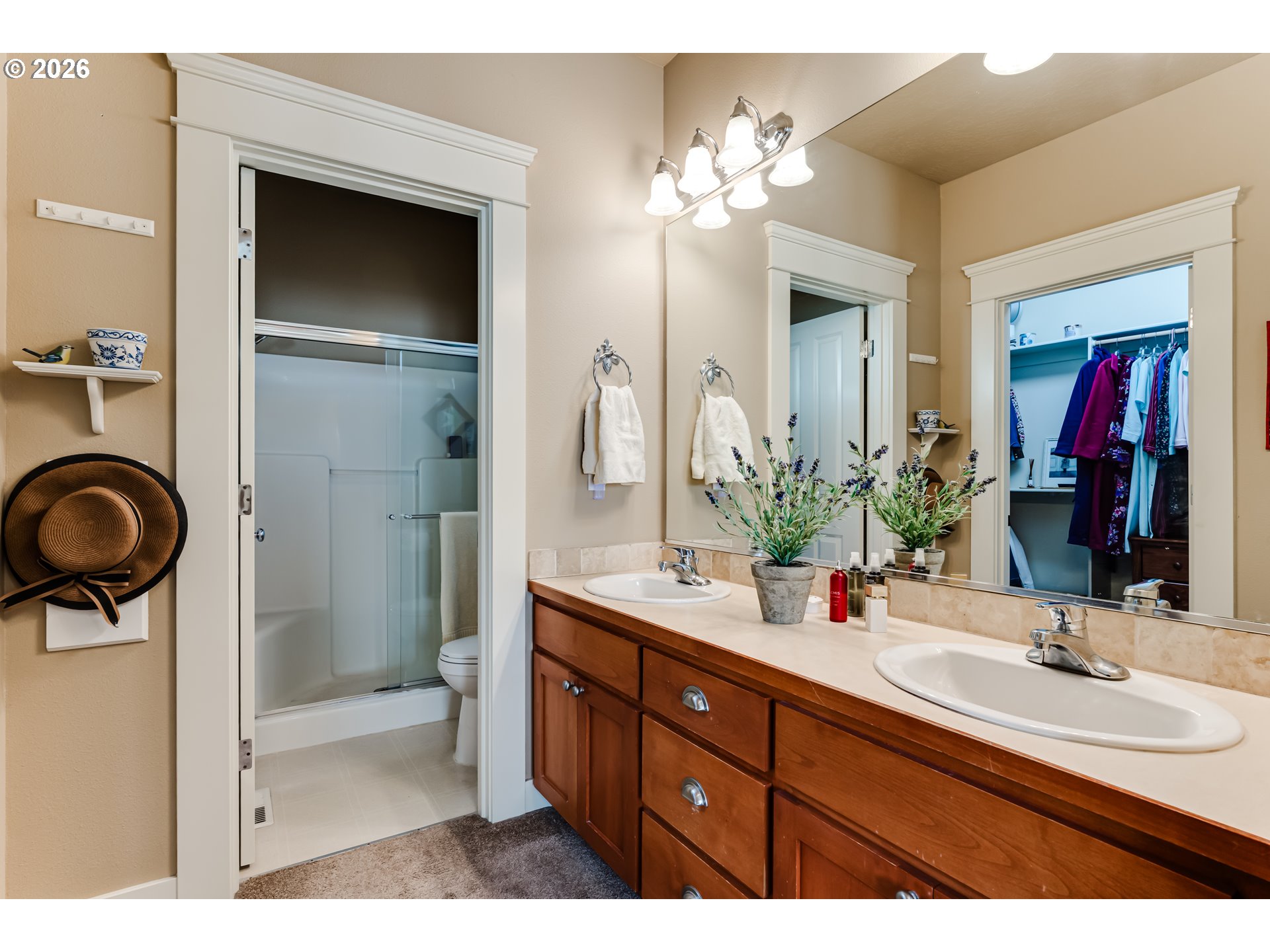 90 Daniel Drive Eugene, OR 97404 - Photo 25 of 48 a bathroom with a double vanity sink a and a mirror