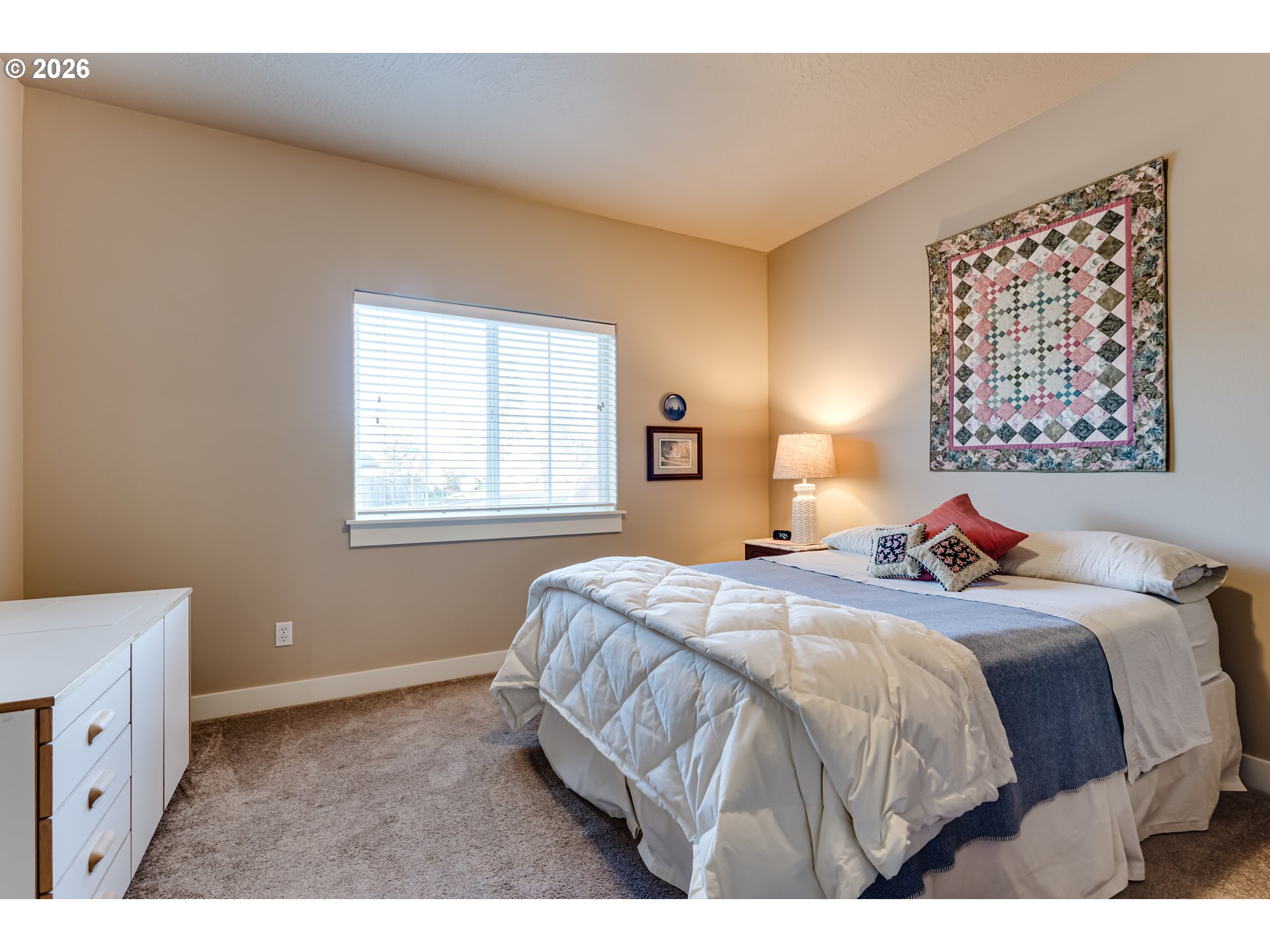90 Daniel Drive Eugene, OR 97404 - Photo 30 of 48 a bedroom with a bed and a window