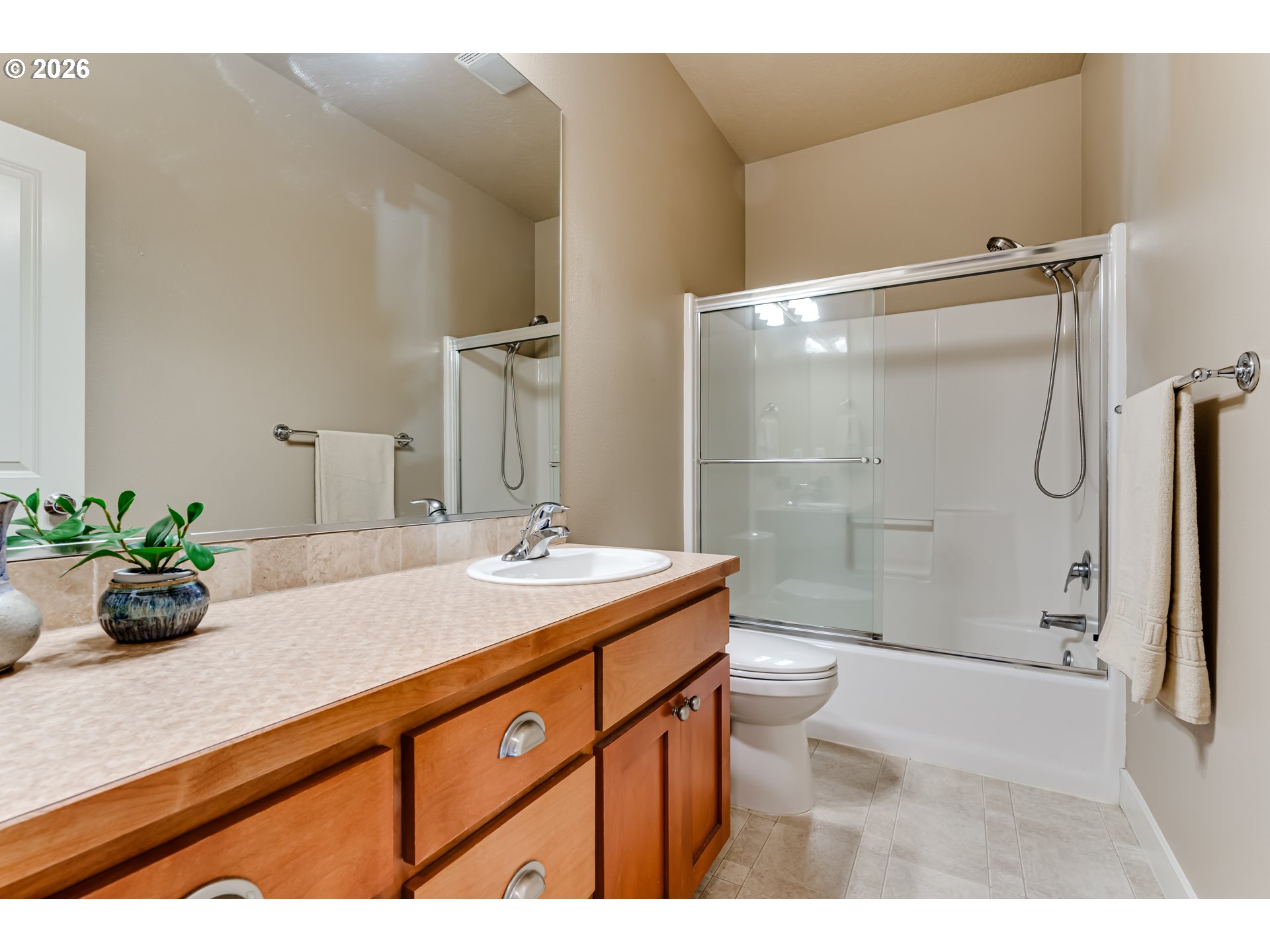 90 Daniel Drive Eugene, OR 97404 - Photo 32 of 48 a bathroom with a granite countertop sink a toilet and shower