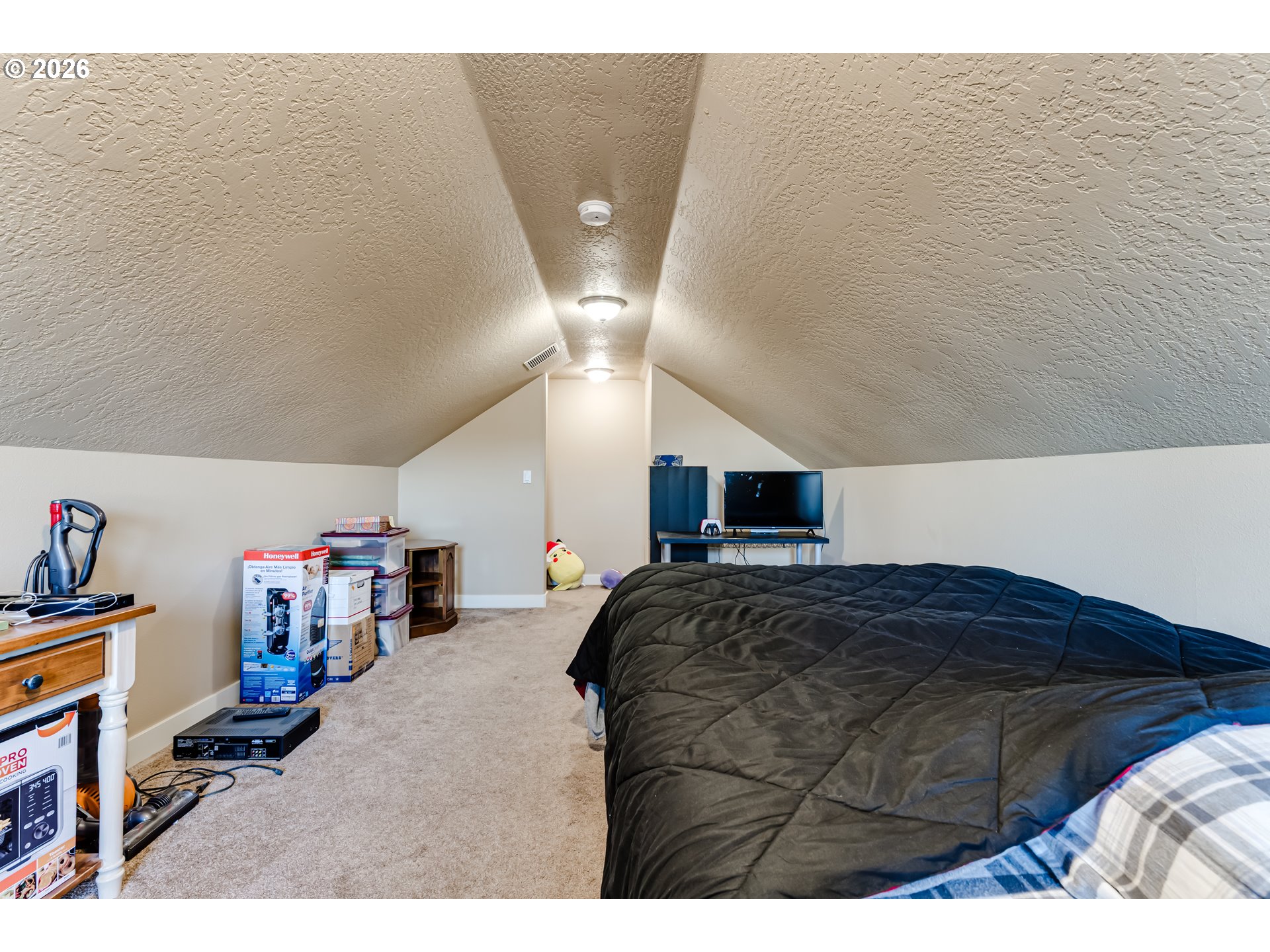 90 Daniel Drive Eugene, OR 97404 - Photo 40 of 48 a bedroom with a bed and a book shelf