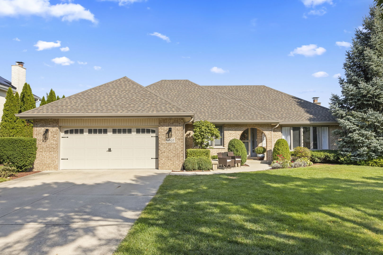 a front view of a house with garden