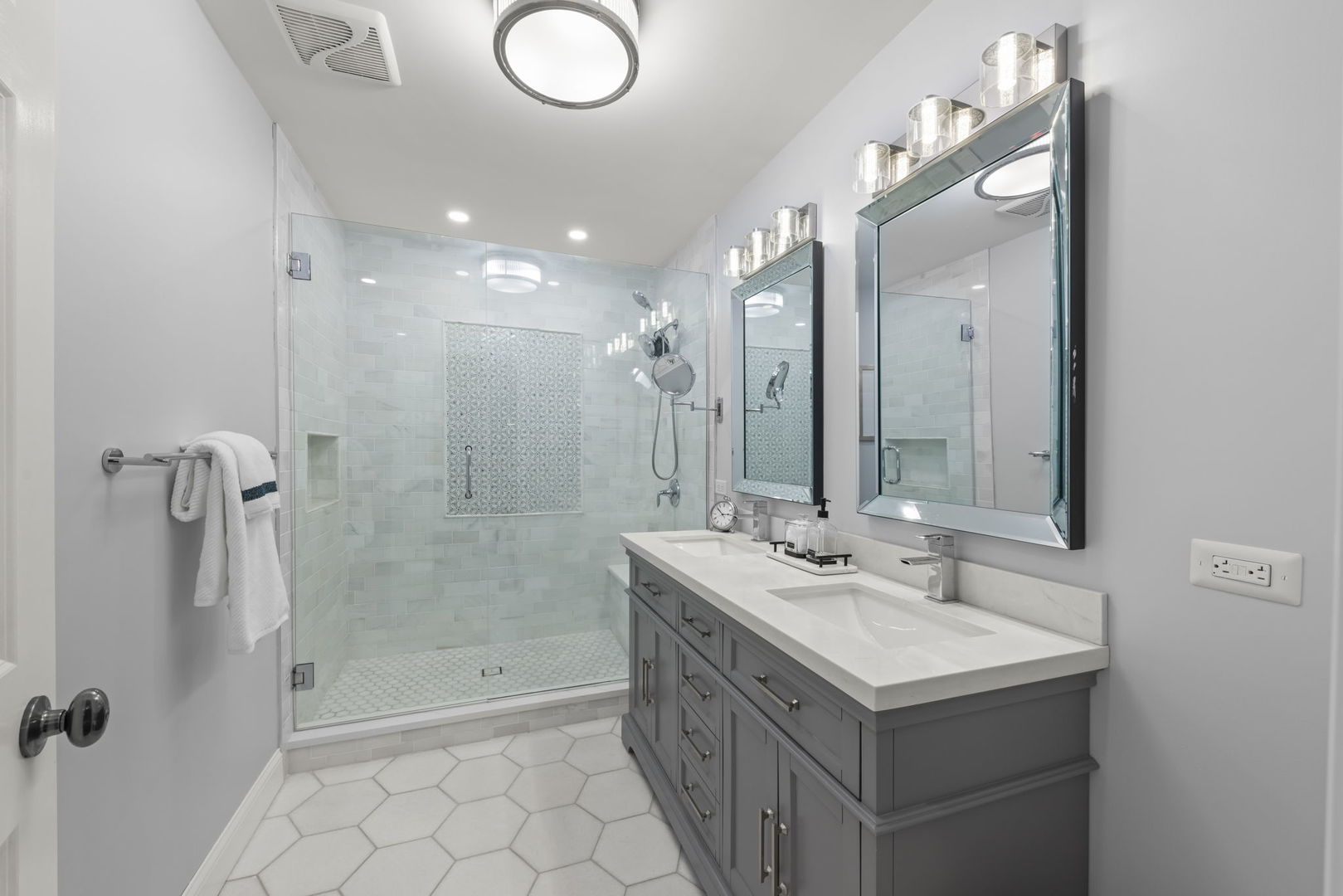 8937 Tara Hill Road Darien, IL 60561 - Photo 11 of 24 a bathroom with a double vanity sink mirror and shower