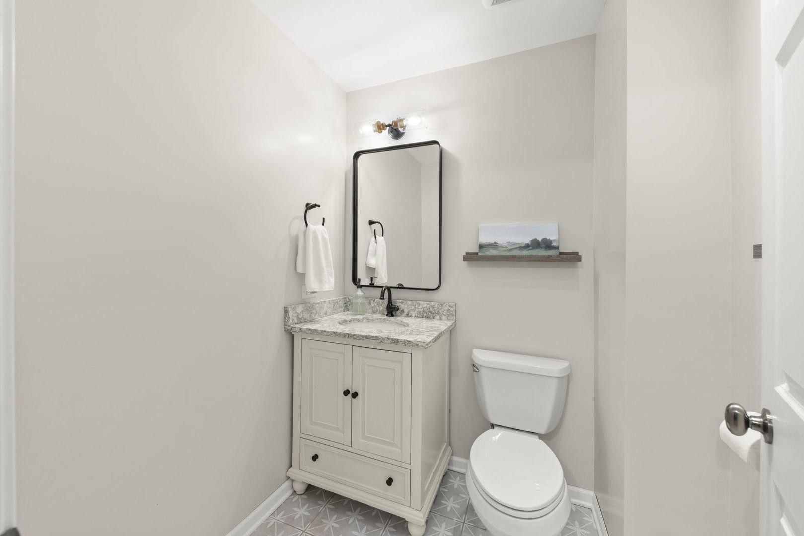 8937 Tara Hill Road Darien, IL 60561 - Photo 16 of 24 a bathroom with a toilet a sink and mirror