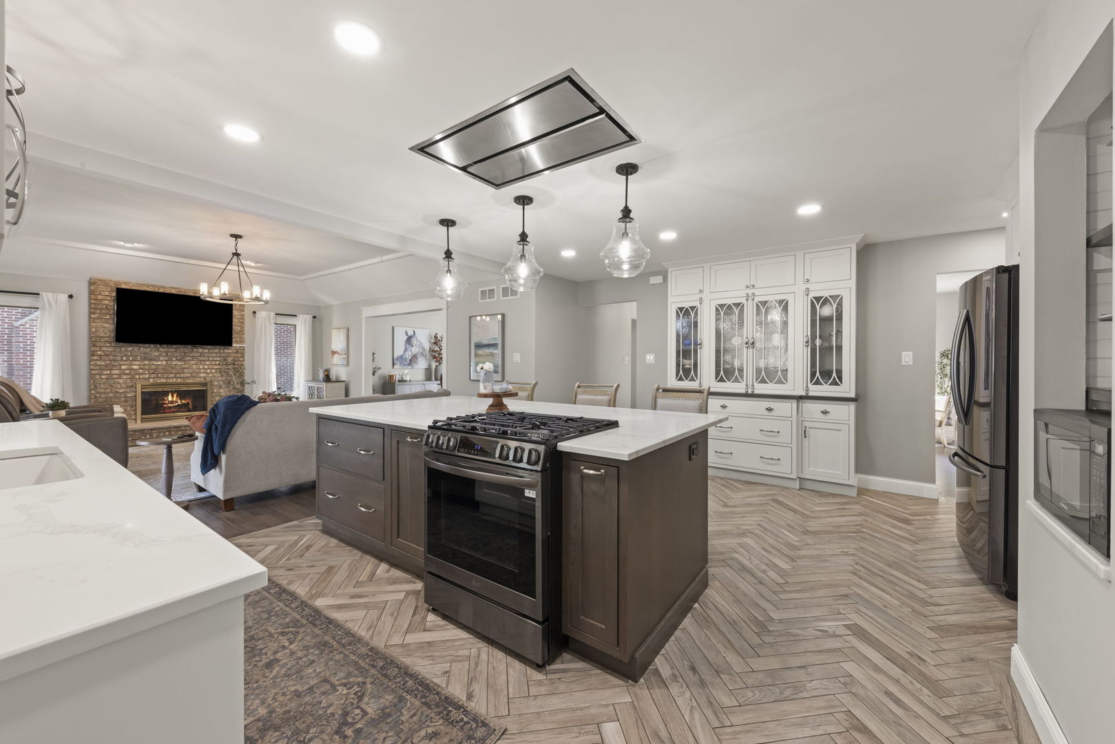 8937 Tara Hill Road Darien, IL 60561 - Photo 2 of 24 a kitchen with stainless steel appliances granite countertop a stove top oven a sink a refrigerator and a dining table with wooden floor