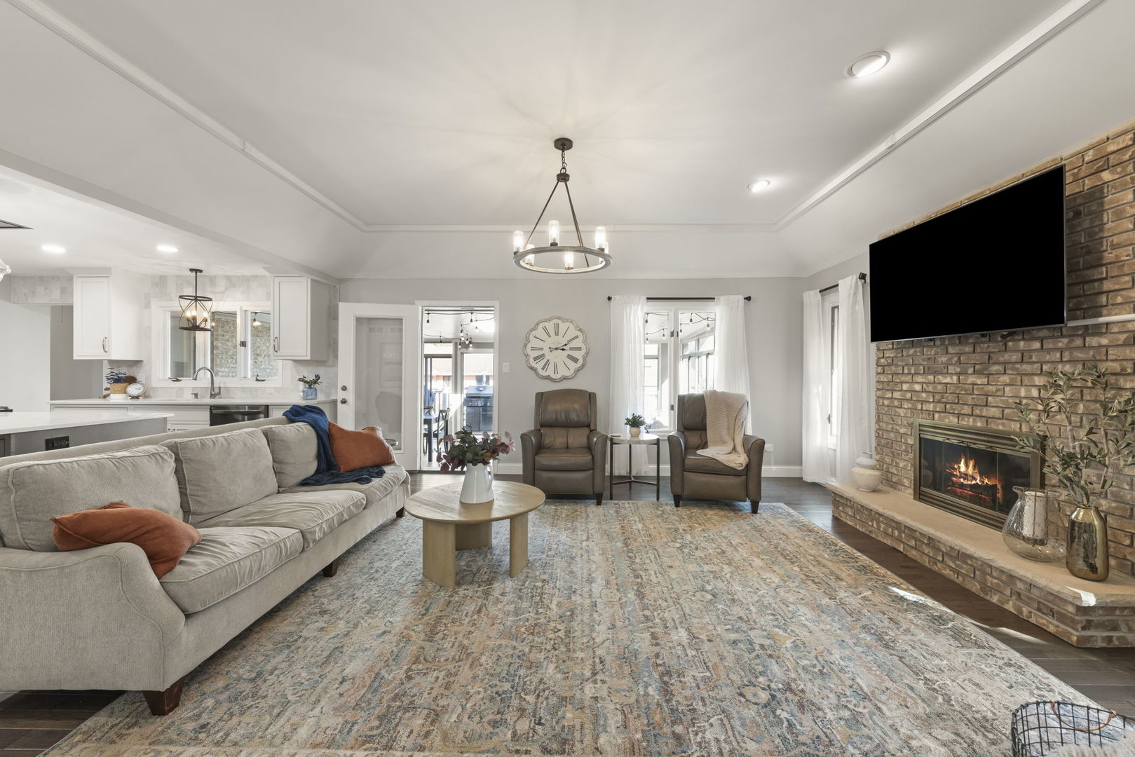 8937 Tara Hill Road Darien, IL 60561 - Photo 5 of 24 a living room with furniture a fireplace and a flat screen tv