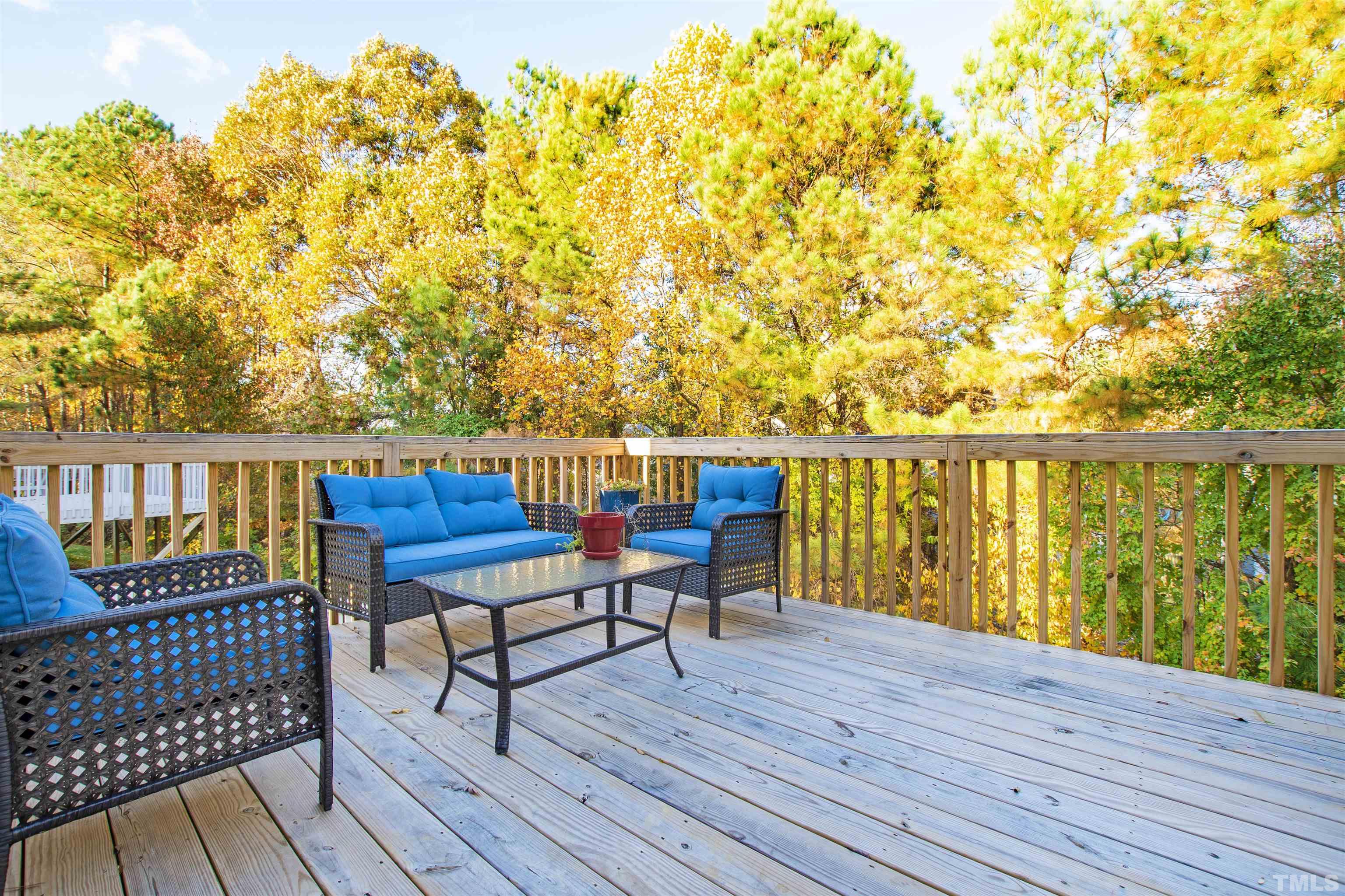 4928 Morning Edge Drive Raleigh, NC 27613 - Photo 22 of 25 a roof deck with table and chairs and wooden floor