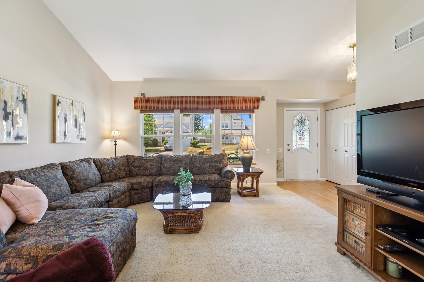 1039 Willow Bay Elgin, IL 60123 - Photo 12 of 30 a living room with furniture and a flat screen tv