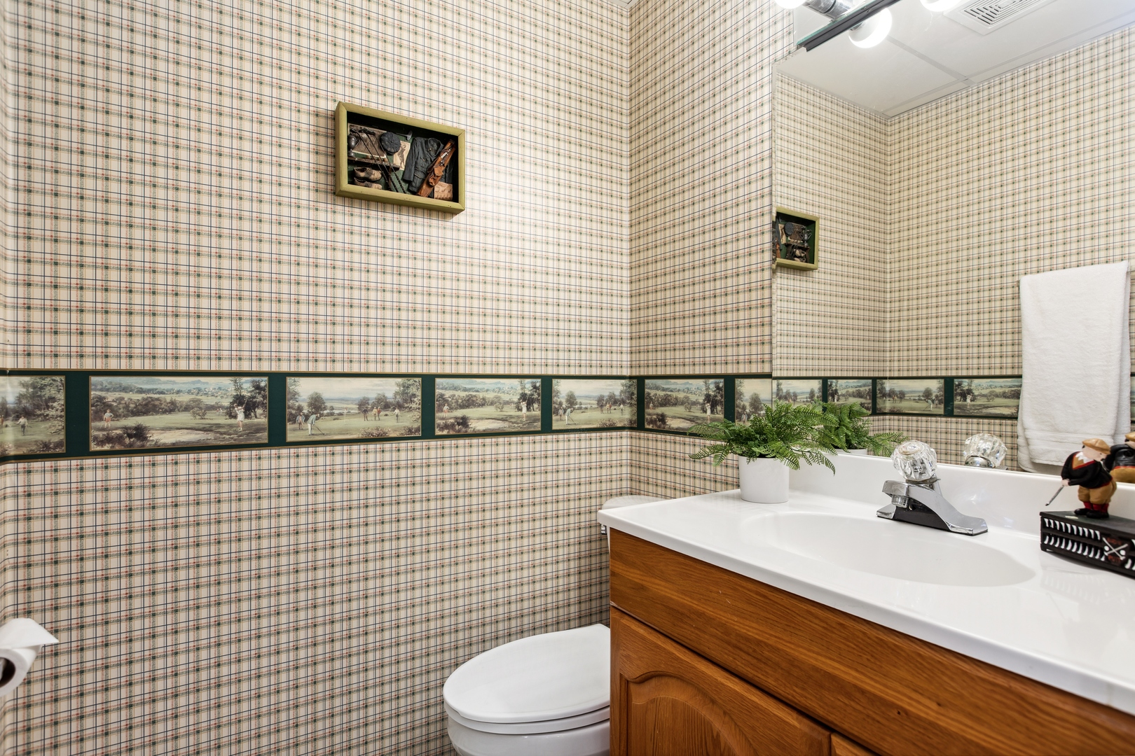 1039 Willow Bay Elgin, IL 60123 - Photo 23 of 30 a bathroom with a sink a toilet and mirror