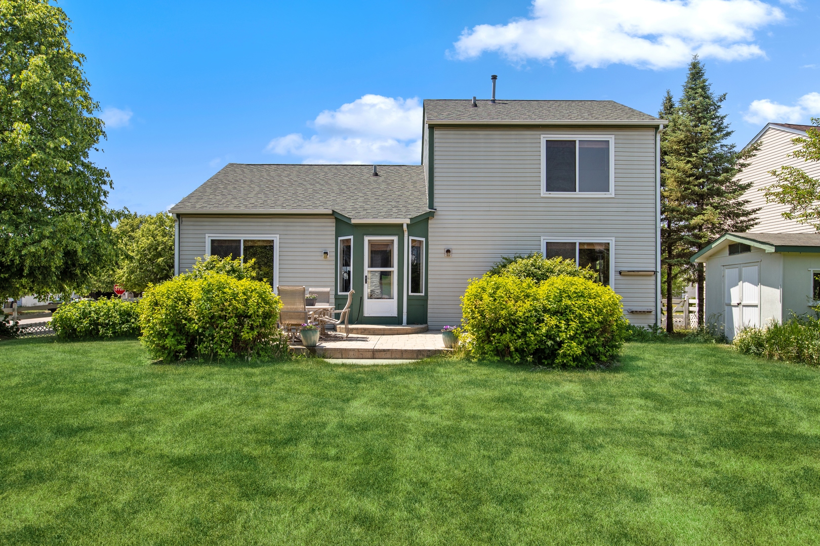 1039 Willow Bay Elgin, IL 60123 - Photo 26 of 30 a view of house with backyard and a patio