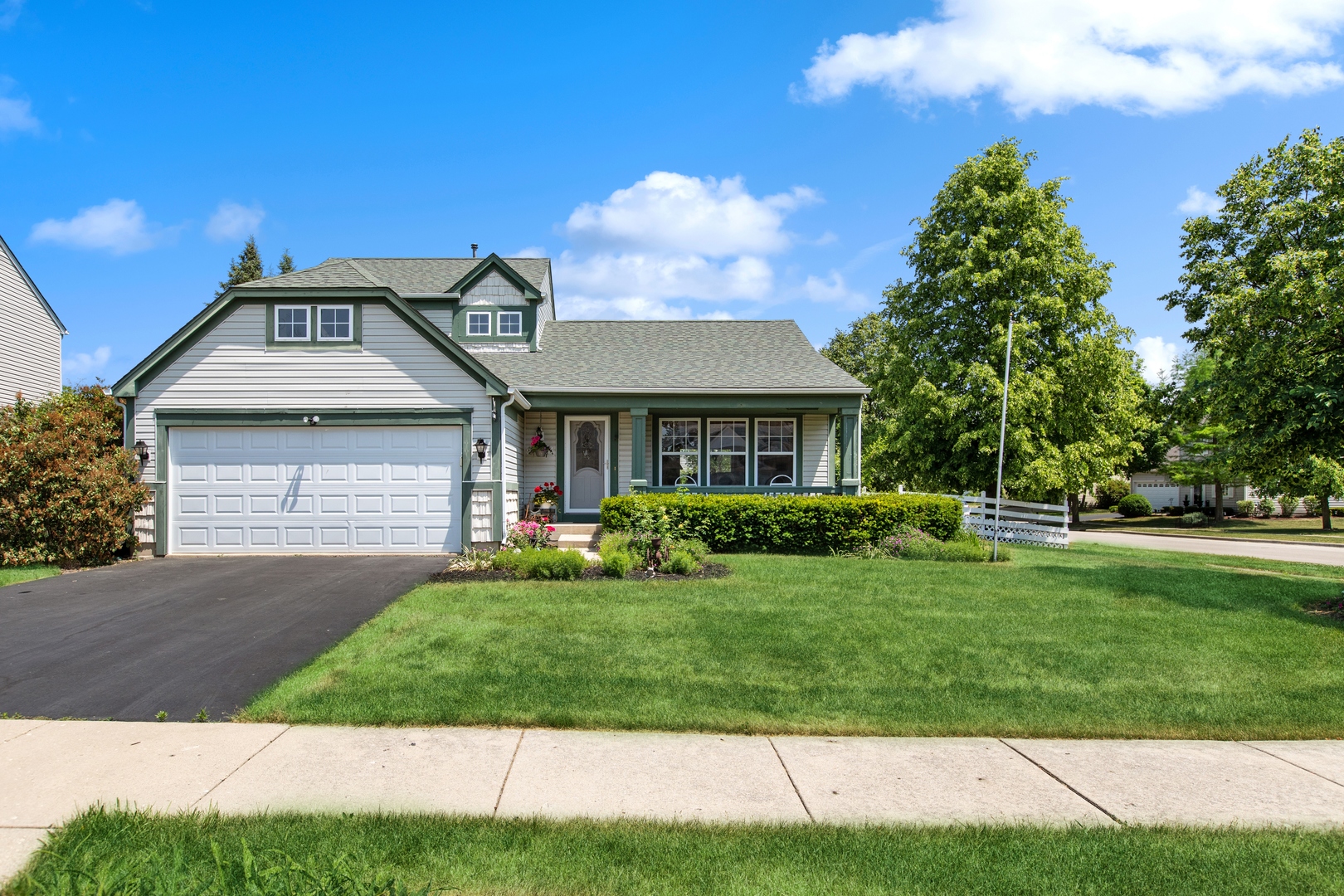 1039 Willow Bay Elgin, IL 60123 - Photo 3 of 30 a front view of a house with a yard