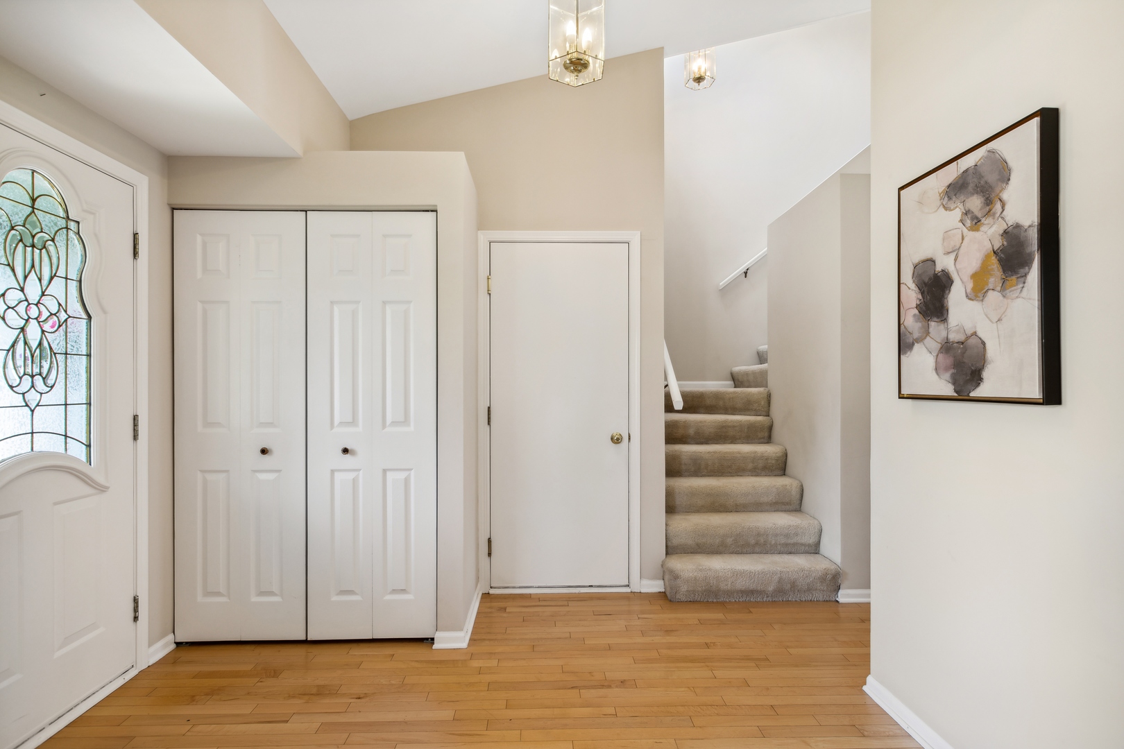 1039 Willow Bay Elgin, IL 60123 - Photo 5 of 30 a view of a hallway with stairs and a window