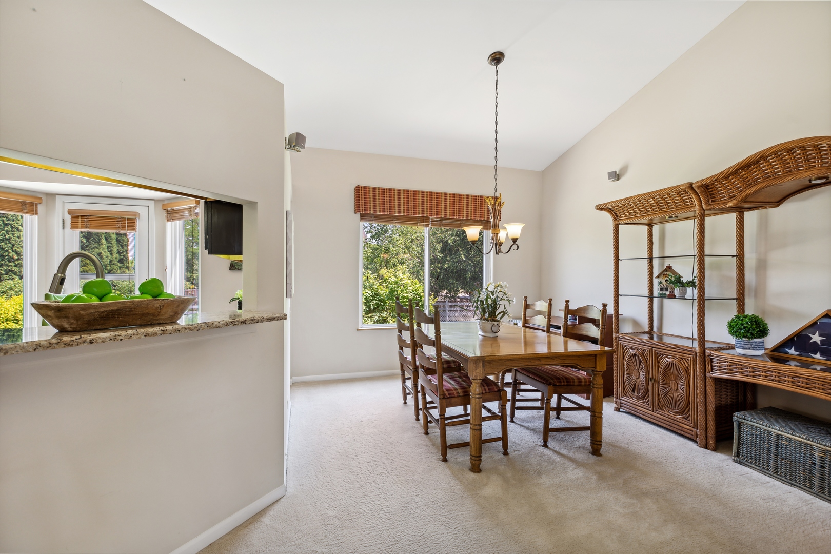 1039 Willow Bay Elgin, IL 60123 - Photo 8 of 30 a view of a dining room and livingroom with furniture wooden floor a chandelier
