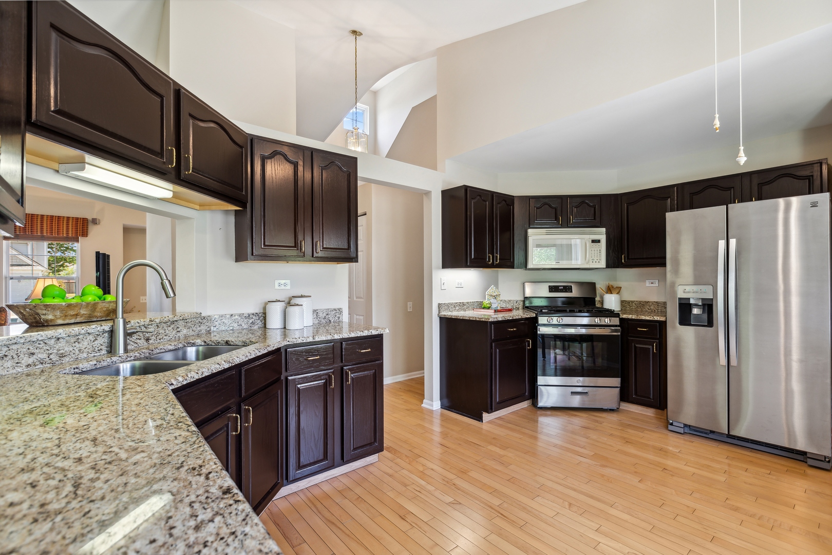 1039 Willow Bay Elgin, IL 60123 - Photo 9 of 30 a kitchen with stainless steel appliances granite countertop a refrigerator a stove top oven a sink and dishwasher