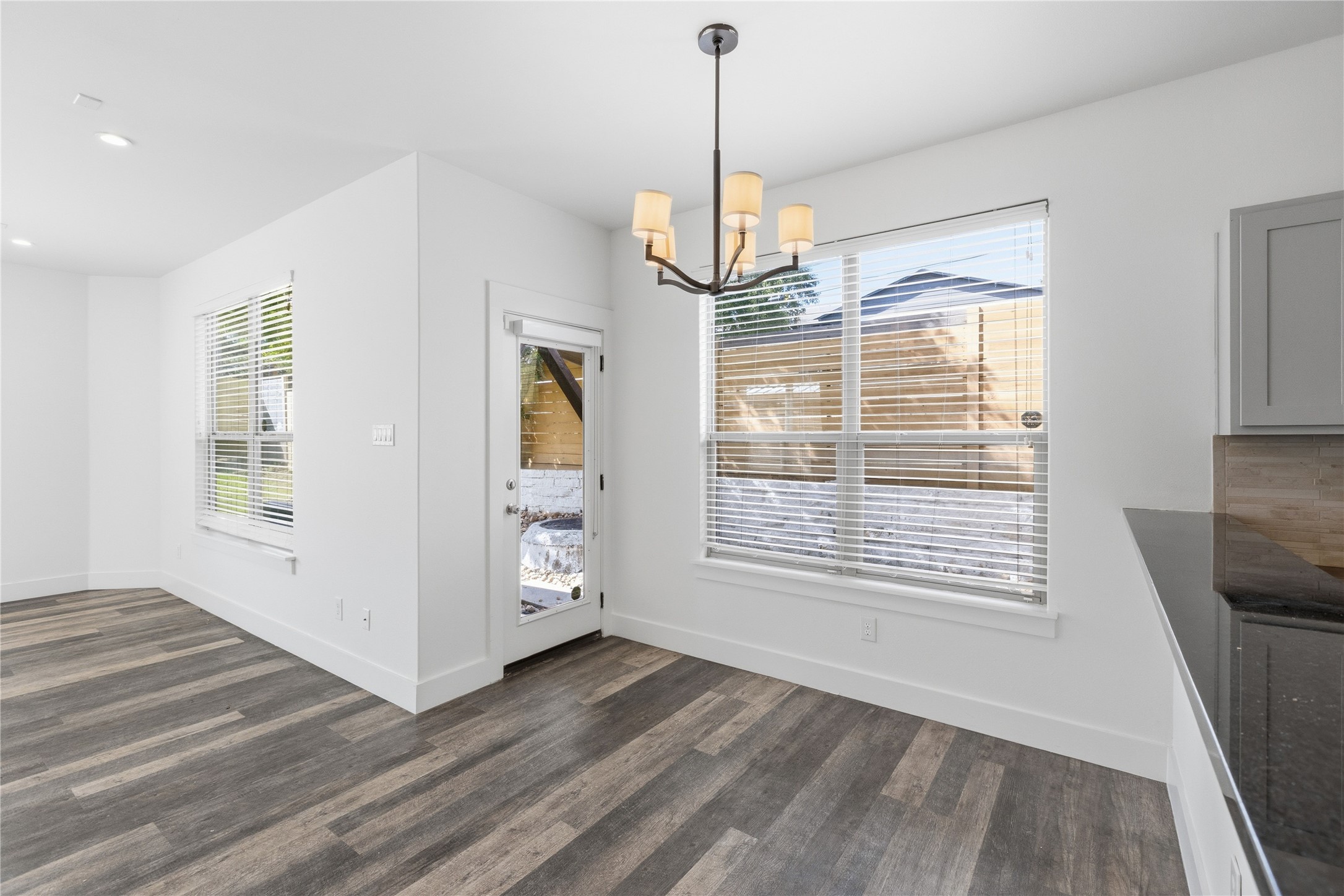 4124 Valley View Road, Unit 4A & 4B Austin, TX 78704 - Photo 30 of 40 Laminated flooring and bright natural illumination enhance this versatile dining area, perfect for everyday meals or entertaining.
