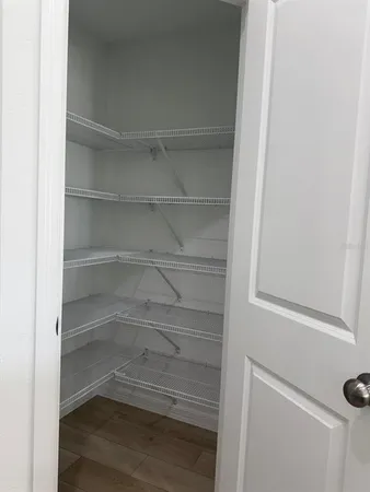 a empty closet with white paint