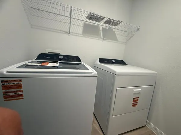 a utility room with dryer and washer