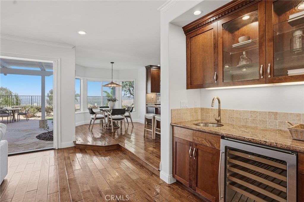 2796 North Meredith Street Orange, CA 92867 - Photo 16 of 55 Wet bar with granite countertop. French doors to backyard