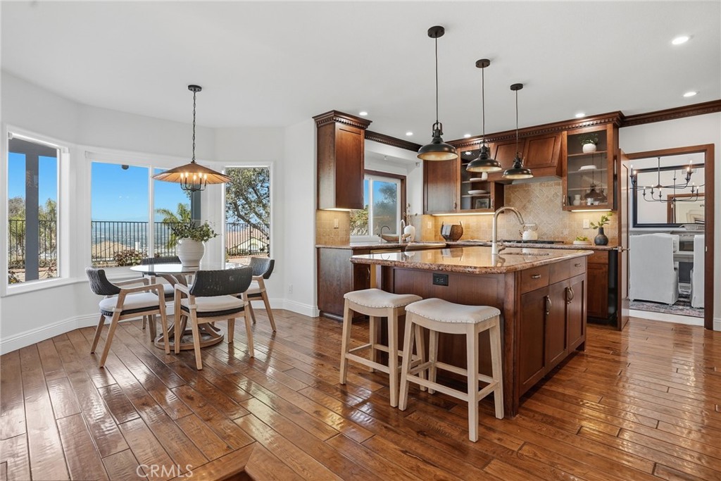 2796 North Meredith Street Orange, CA 92867 - Photo 21 of 55 Kitchen with stainless steel appliances, breakfast nook with views and wood floors