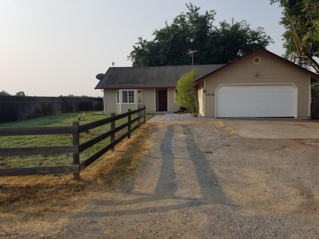 23135 Kindlespire Road Proberta, CA 96078 - Photo 1 of 33 a view of a house with a yard