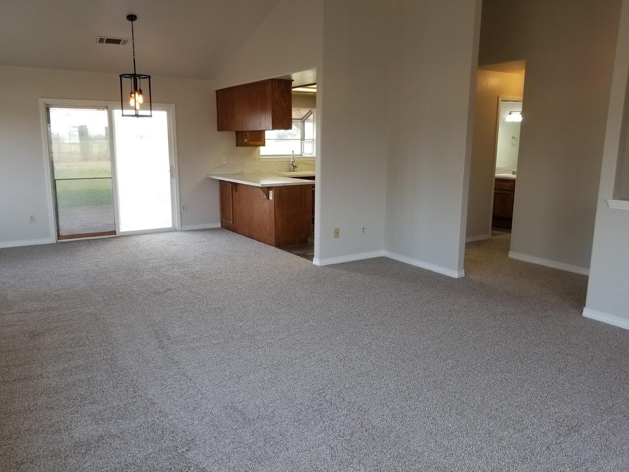 23135 Kindlespire Road Proberta, CA 96078 - Photo 8 of 33 a view of kitchen and empty room with windows
