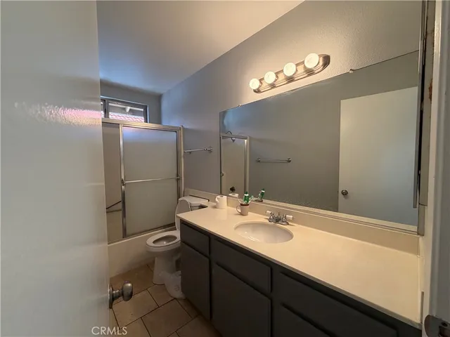 a bathroom with a sink vanity and a mirror