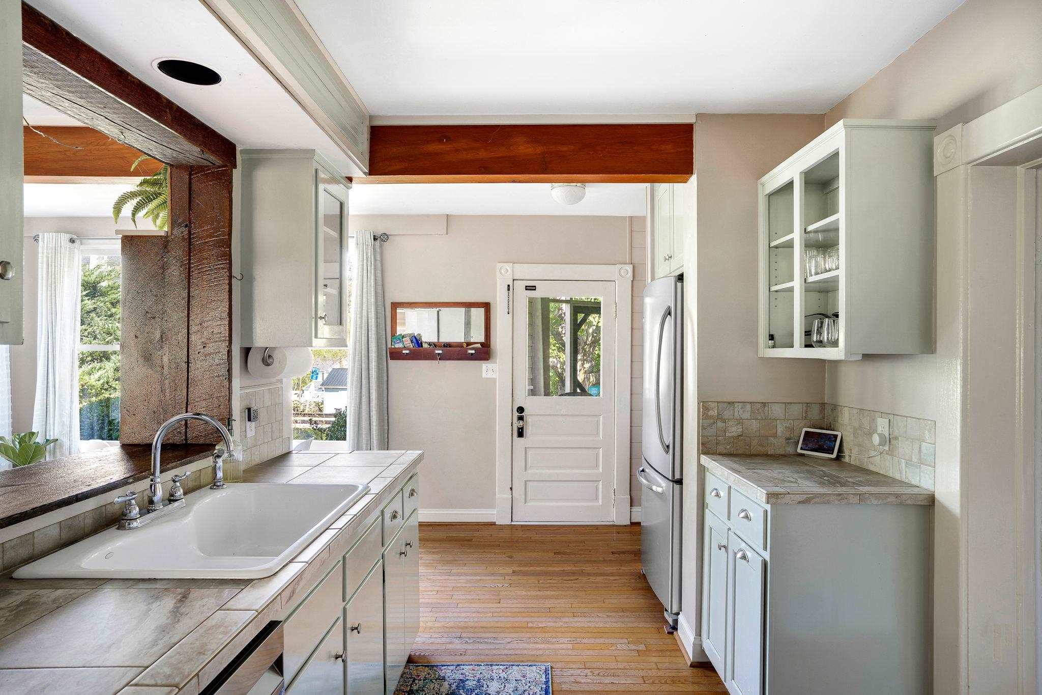 5979 Back Road Woodstock, VA 22664 - Photo 11 of 49 a kitchen with a sink stove and cabinets
