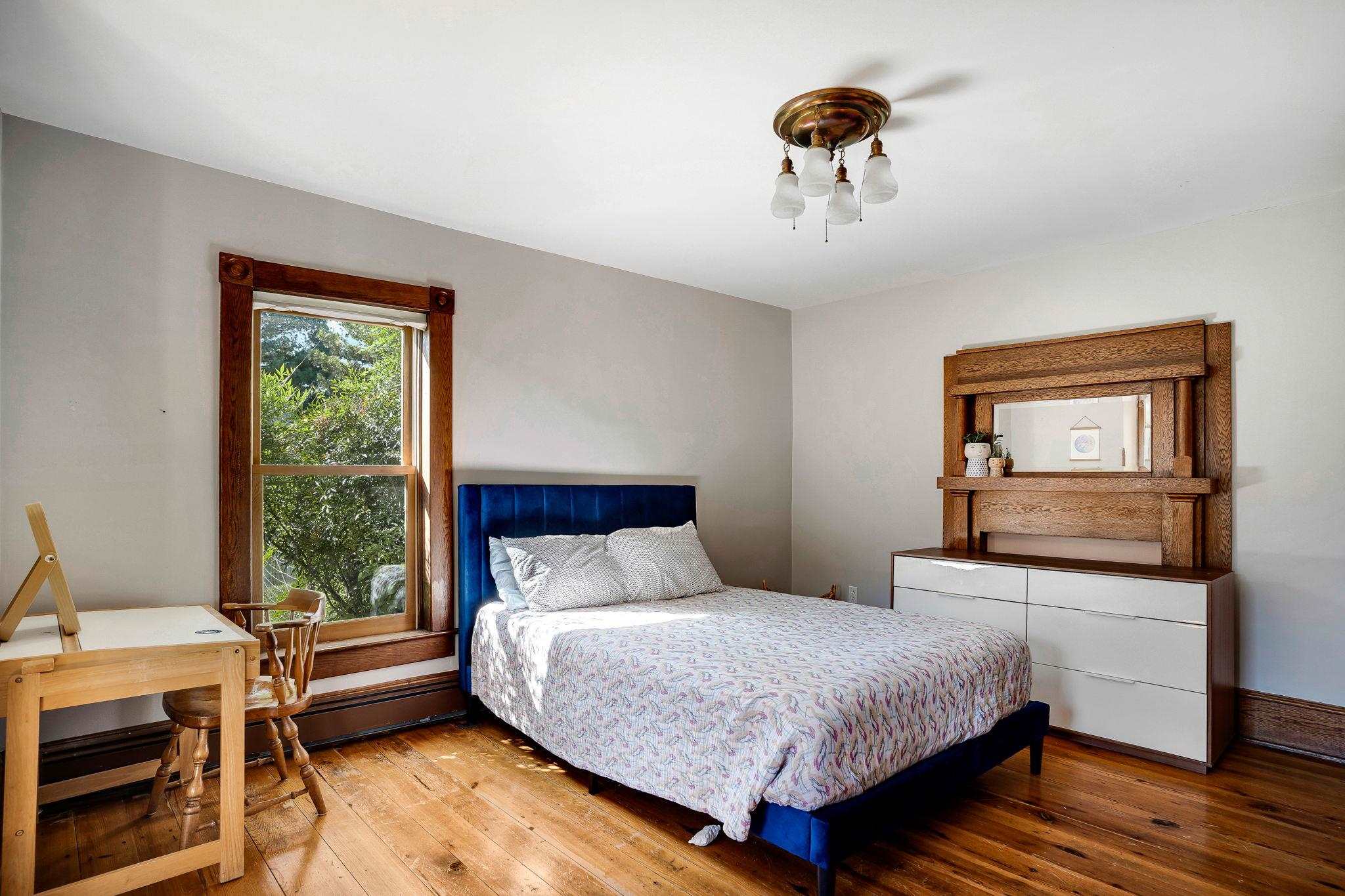5979 Back Road Woodstock, VA 22664 - Photo 25 of 49 a bedroom with a bed and wooden floor