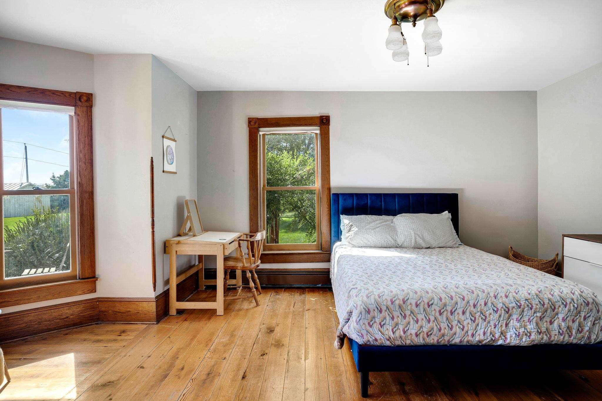 5979 Back Road Woodstock, VA 22664 - Photo 26 of 49 a bedroom with a bed and wooden floor