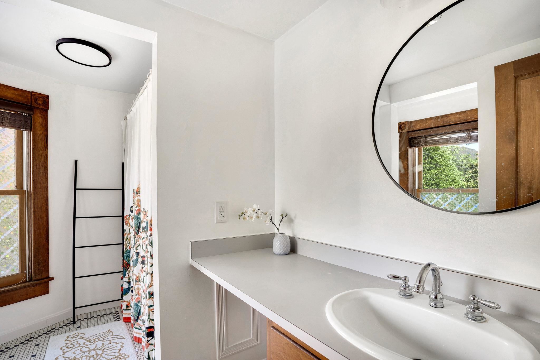 5979 Back Road Woodstock, VA 22664 - Photo 33 of 49 a bathroom with a sink and a mirror