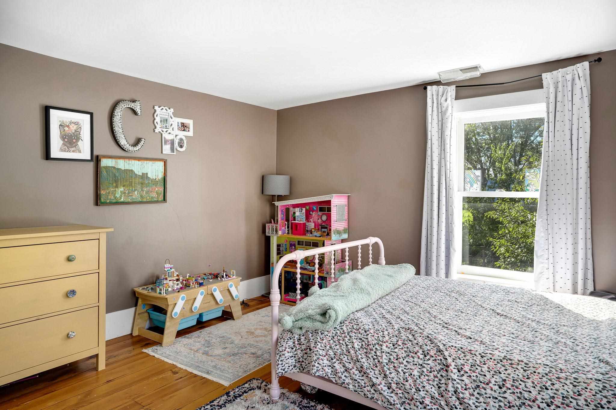 5979 Back Road Woodstock, VA 22664 - Photo 36 of 49 a bedroom with a bed and wooden floor