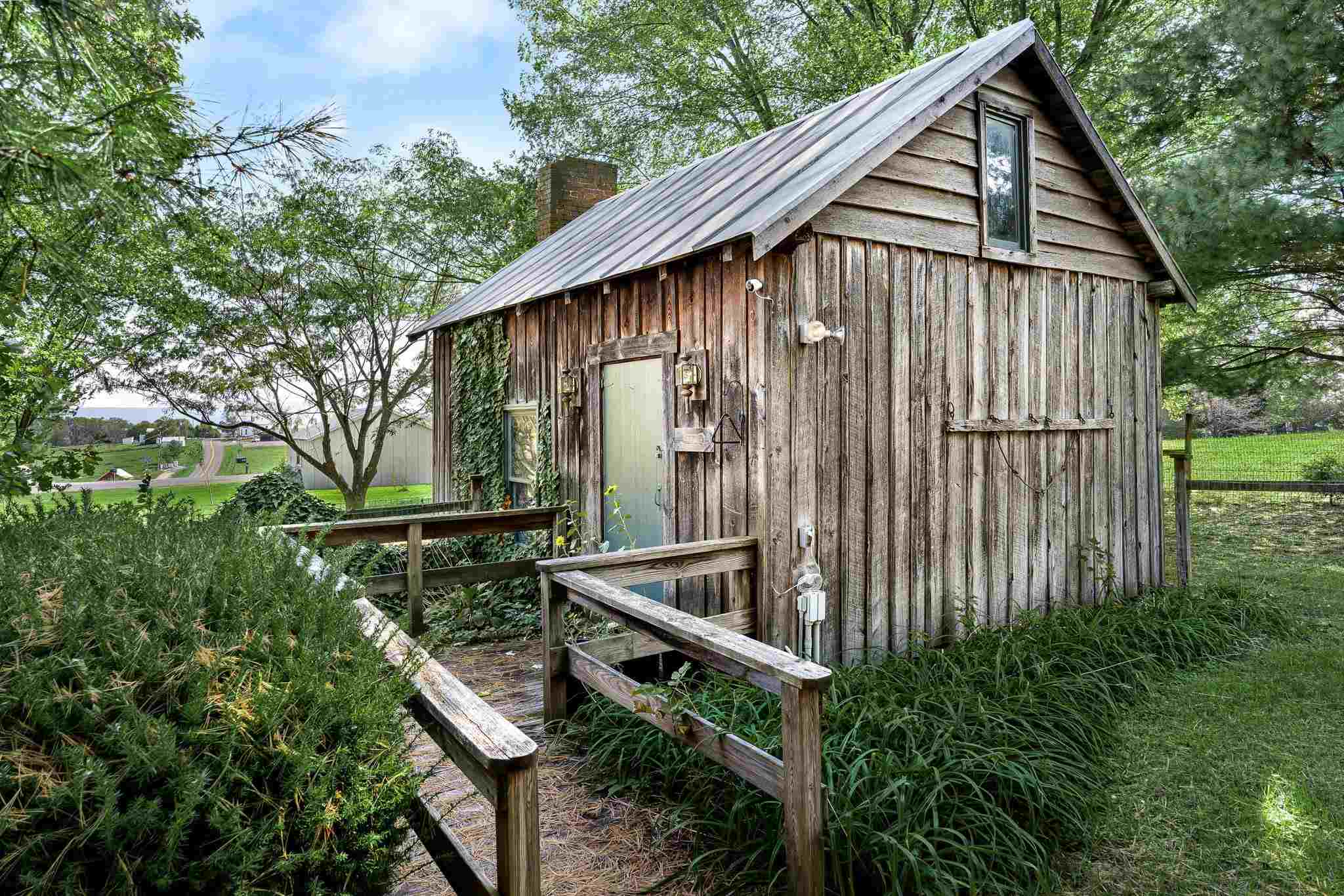 5979 Back Road Woodstock, VA 22664 - Photo 39 of 49 a backyard of a house with table and chairs