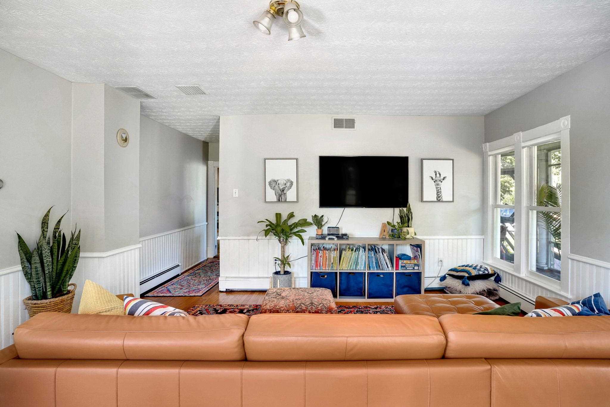 5979 Back Road Woodstock, VA 22664 - Photo 9 of 49 a living room with a couch and a flat screen tv