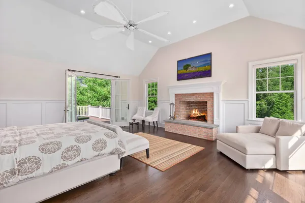 a bedroom with a bed and a fireplace