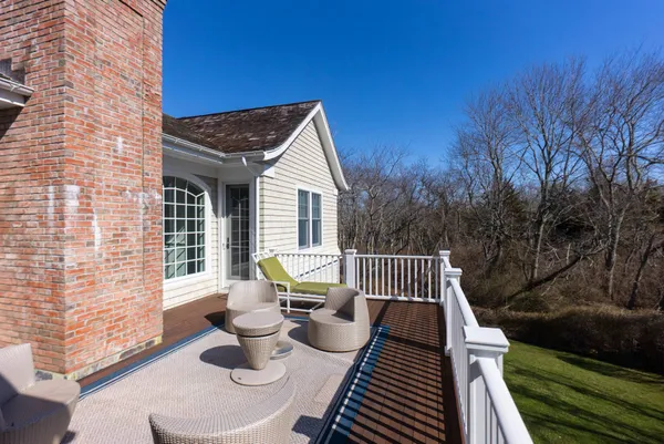 a view of a patio in the backyard