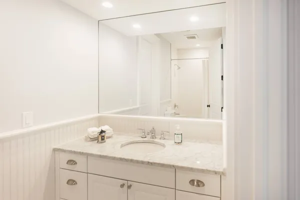 a living room with furniture rug and wooden floor