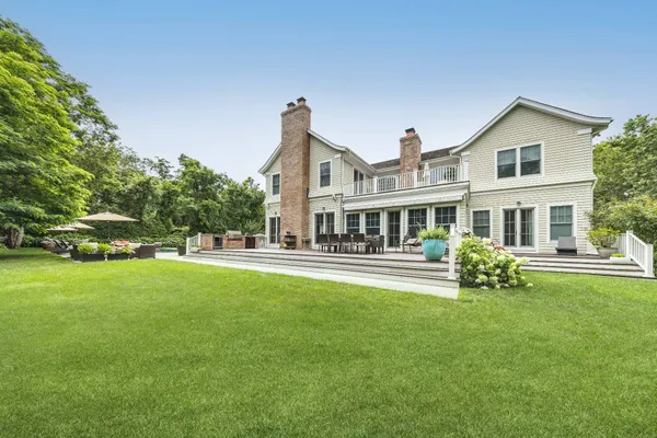 a front view of house with yard and seating area