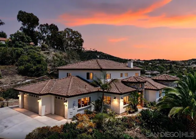a view of a house with a garden