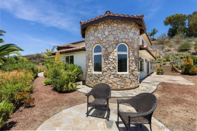 an aerial view of a house with a big yard