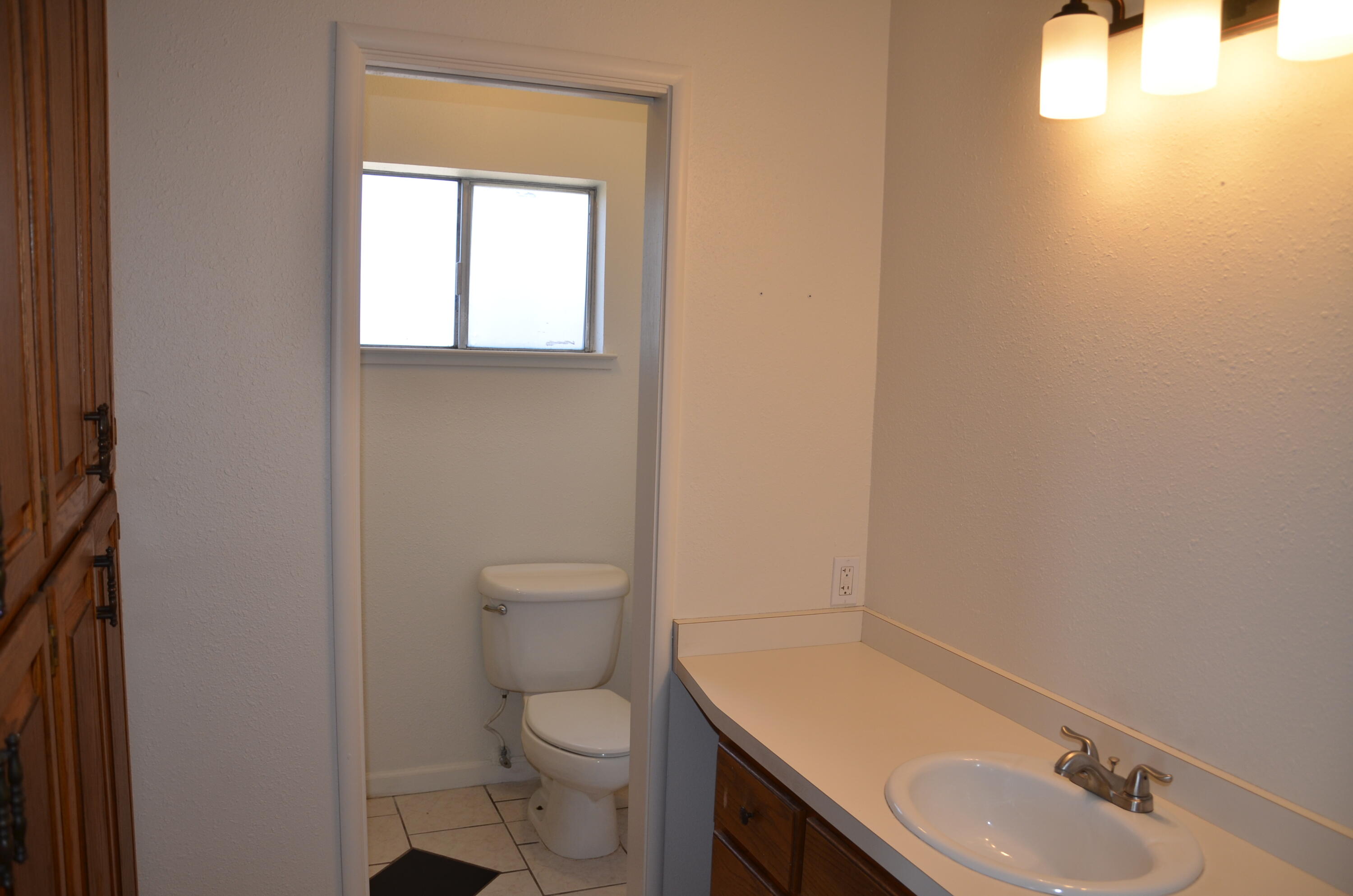 339 West Spring Lane Lemoore, CA 93245 - Photo 23 of 31 a bathroom with a sink toilet and vanity