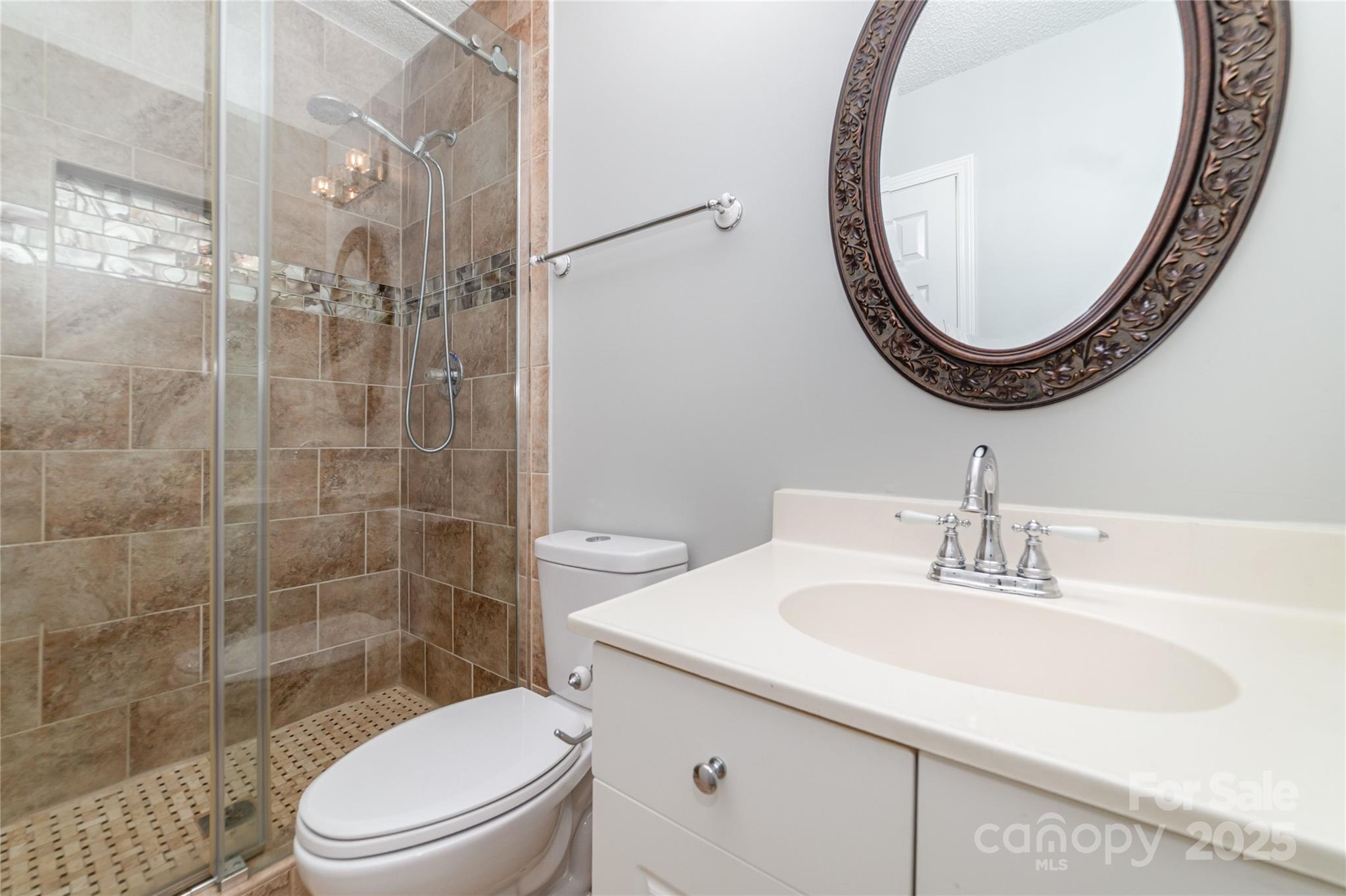 200 Sidney Court Monroe, NC 28110 - Photo 13 of 18 a bathroom with a sink a toilet and a mirror