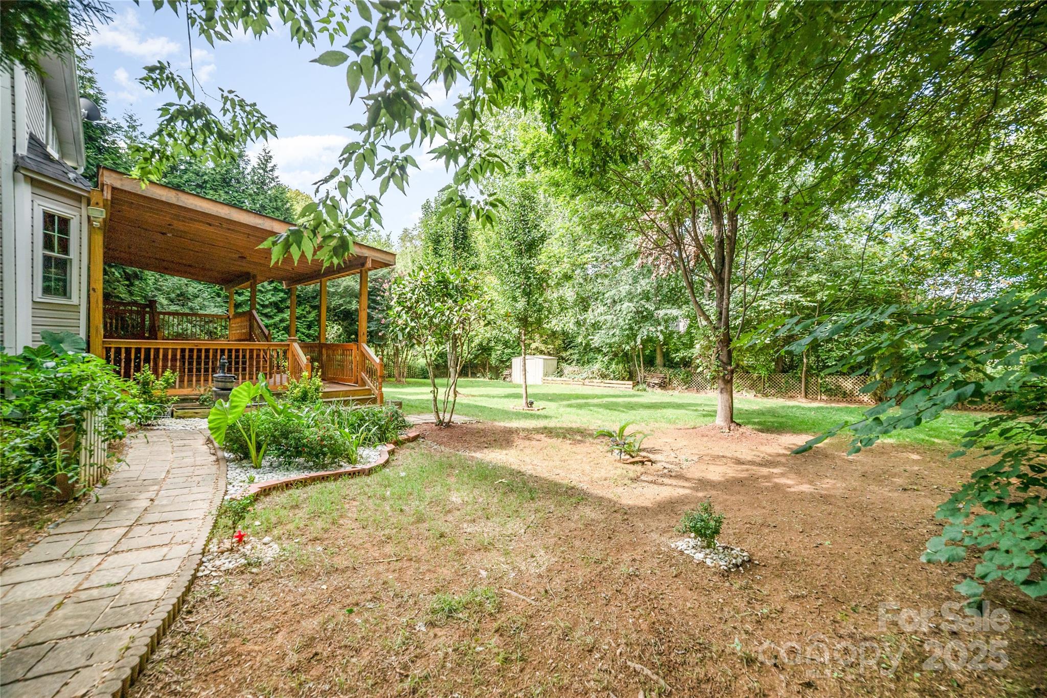 200 Sidney Court Monroe, NC 28110 - Photo 16 of 18 a view of a yard with plants and trees