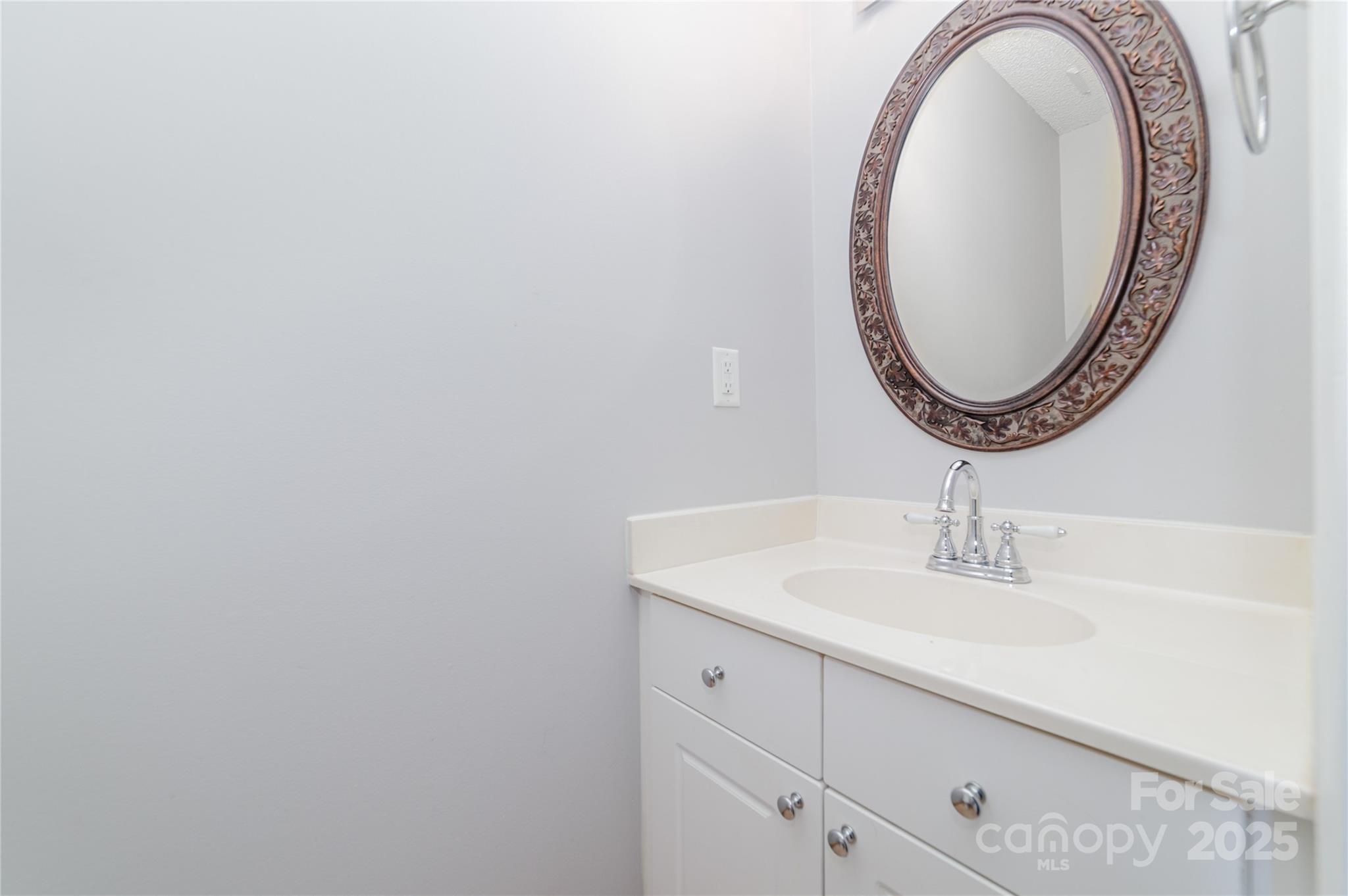 200 Sidney Court Monroe, NC 28110 - Photo 7 of 18 a bathroom with a sink and a mirror